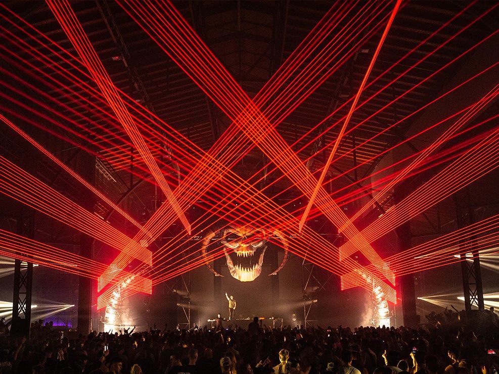 Lasers and strobes at an electronic music event Strobe lights and laser effects at electronic music festival